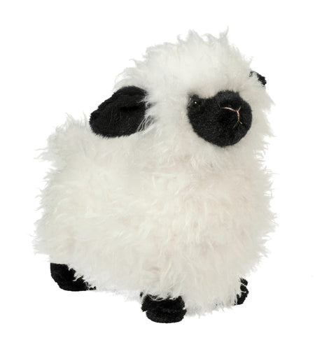 A plush stuffed animal resembling a Sheep with a white fleece body and a black face and legs.