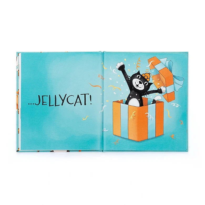 Illustrated black and white cat popping out of orange and blue gift box.  Text reads "Jellycat!"