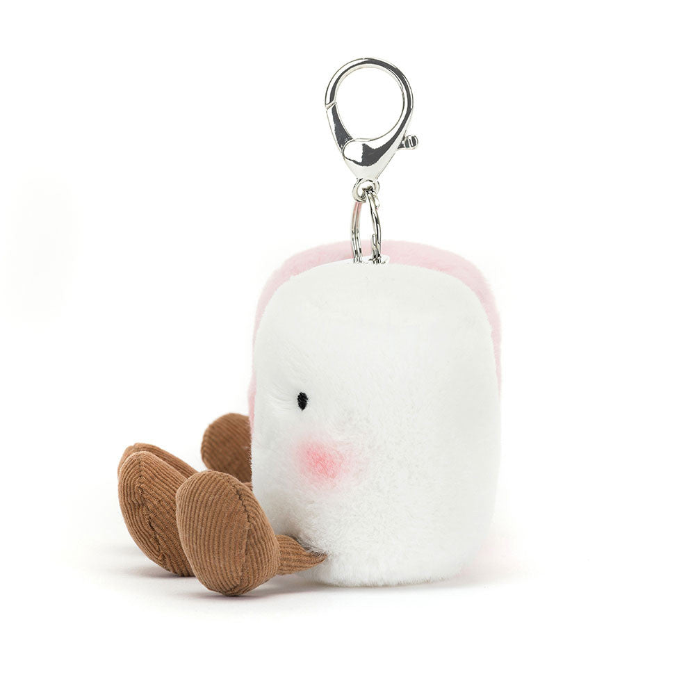 Side view of clip keychain. Shows white marshmallow with smiley face and feet.