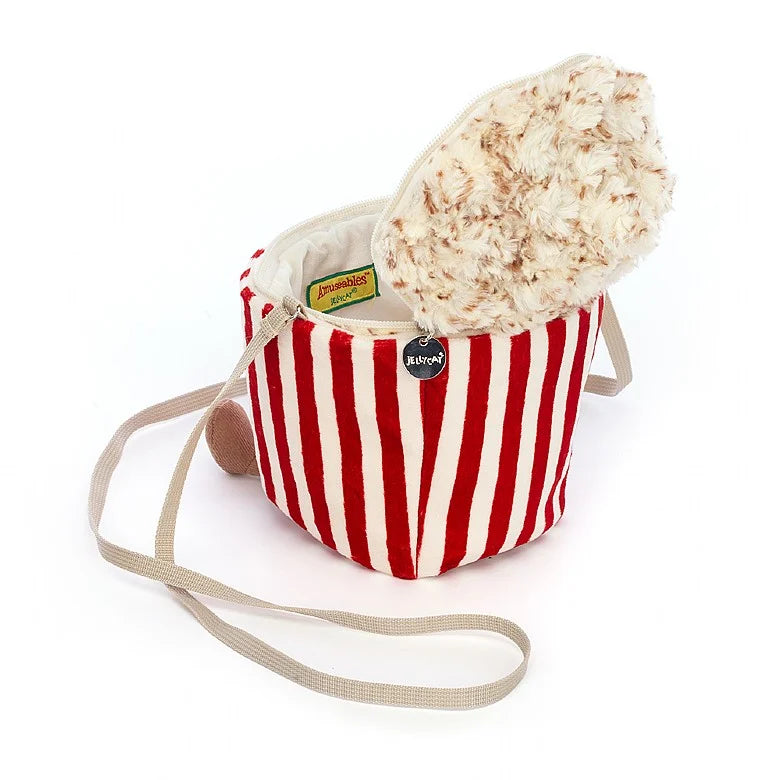 Stuffed popcorn bag with striped tub facing backward with zipper open