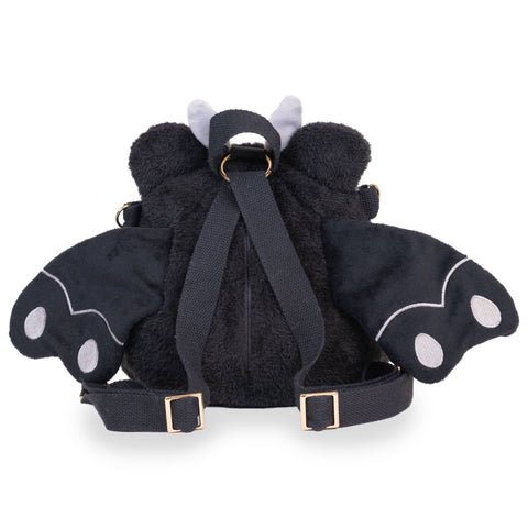 Image shows a back view of the stuffed mothman-frog backpack