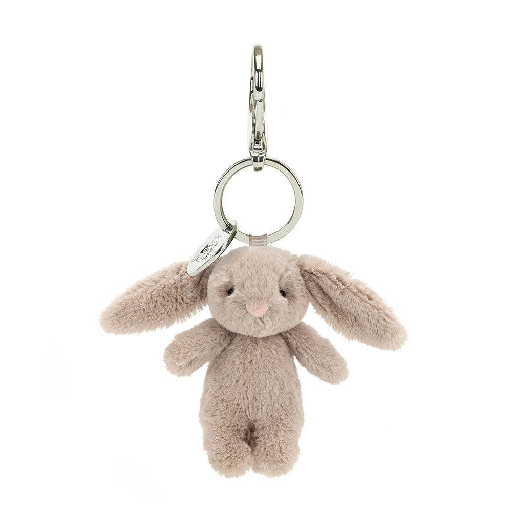 Stuffed beige bunny hanging from clip keychain