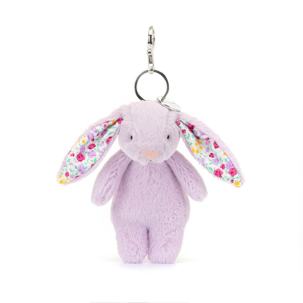 Stuffed lavender colored bunny with floral fabric inside ears hanging from clip keychain