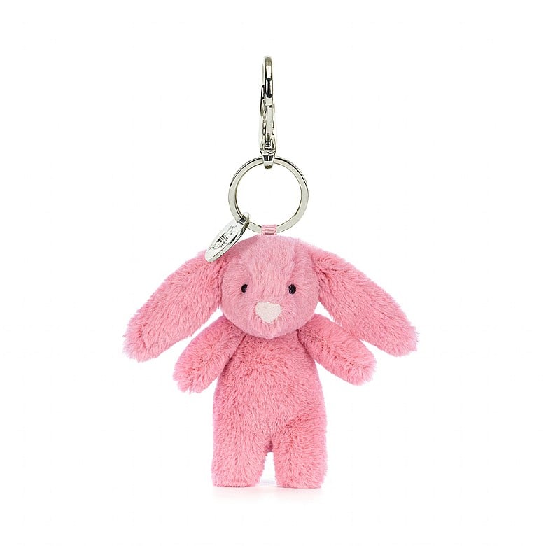 Stuffed pink bunny hanging from a clip keychain