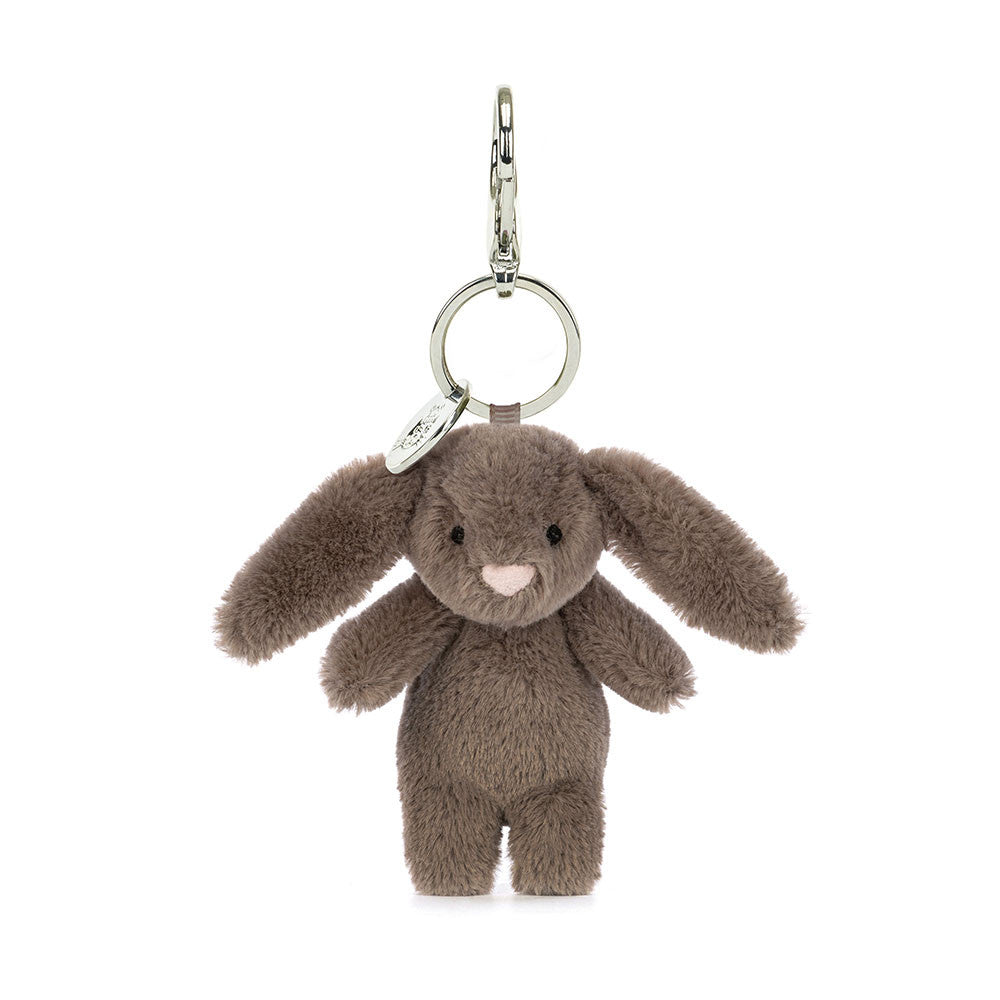 A stuffed brown bunny hanging from a clip keychain