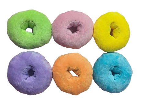 Image shows the rainbow-colored cereal loops from inside the stuffed cereal box.