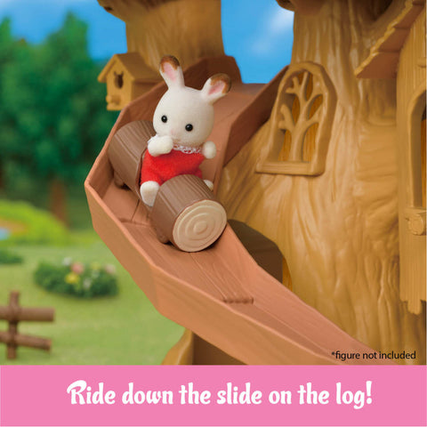 Toy rabbit figure on a log slide with a treehouse background