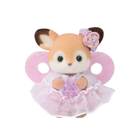 Toy baby deer in a pink dress with a flower on a white background
