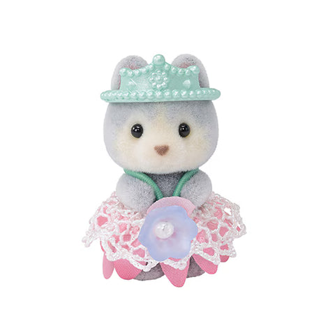 Small baby Husky toy with a tiara and dress on a white background