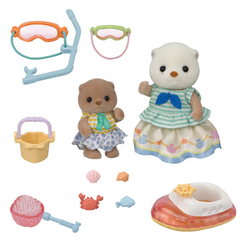 Sea otter toy figures and various beach accessories, including two goggles and a snorkle