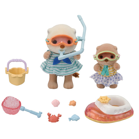 Two toy figures with snorkeling gear and accessories on a white background