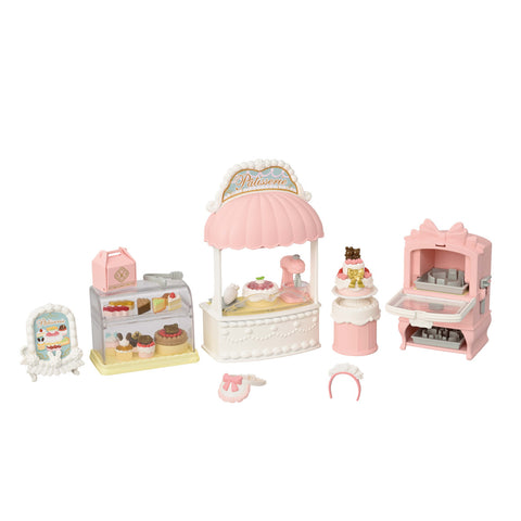 Set of miniature bakery playsets on a white background