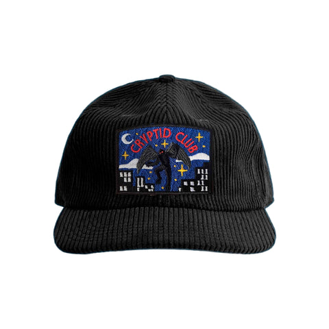 Black corduroy hat with a Mothman "Cryptid Club" patch