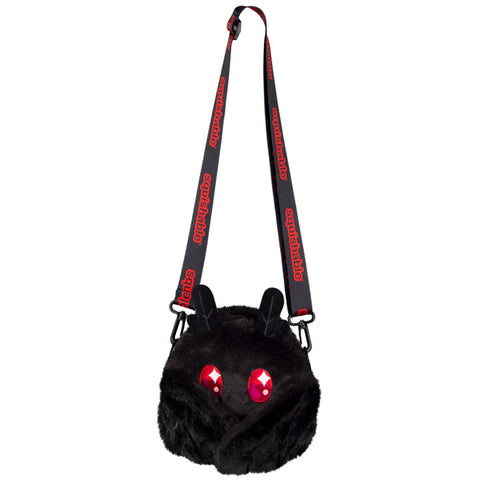 A crossbody bag with a plush baby Mothman with his wings closed. They are held together by magnets.