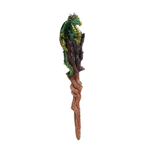 Image shows a brown magic wand with a green dragon sitting on top