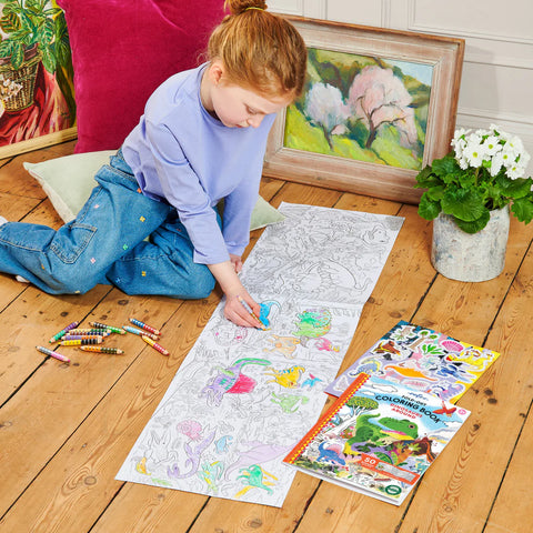 Image shows a young child coloring one of the fold out pages
