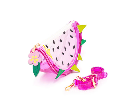 Image shows a jelly-like handbag styled as a piece of dragon fruit. It has a pink strap in front of the bag.