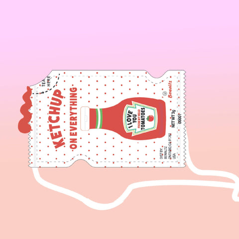Image shows a drawing of a crossbody bag in the shape of a ketchup packet. It reads "ketchup on everything" and has a bottle of ketchup.
