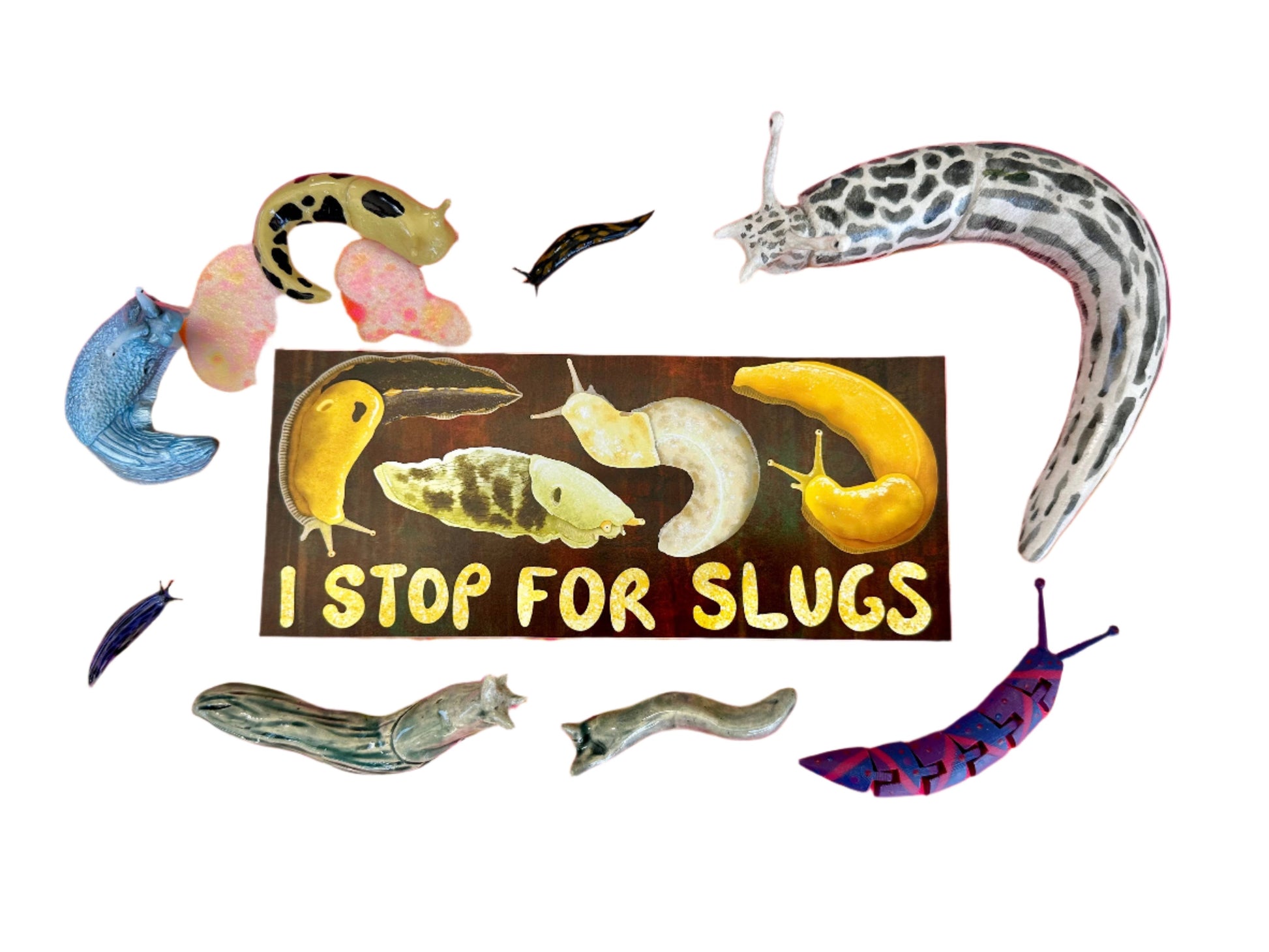 A brown bumper sticker with four slugs. It reads "I stop for slugs". The bumper sticker is surrounded by assorted slugs.