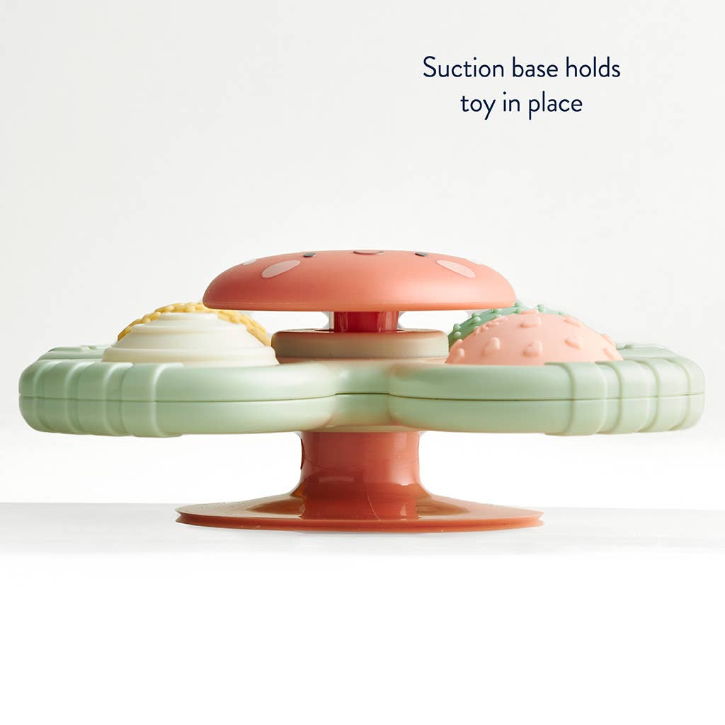 Image depicts a suction cup base which holds the toy in place