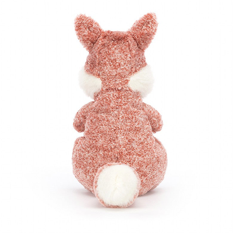 Back view of A stuffed fox with patterned red fur