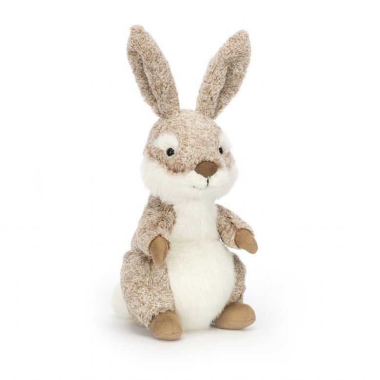 A seated stuffed rabbit with patterned tan fur and tall ears