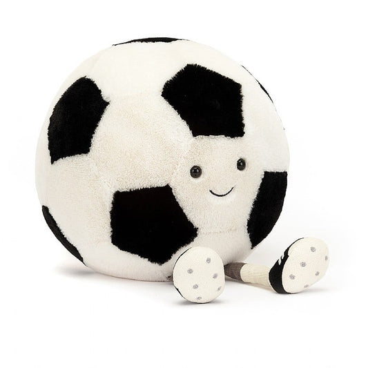 A stuffed soccer ball with a smiley face and feet wearing cleats