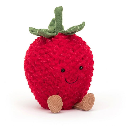 A stuffed strawberry with a smiley face and feet