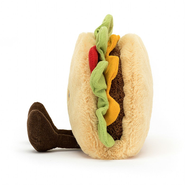 The side view of A stuffed taco with a smiley face and feet