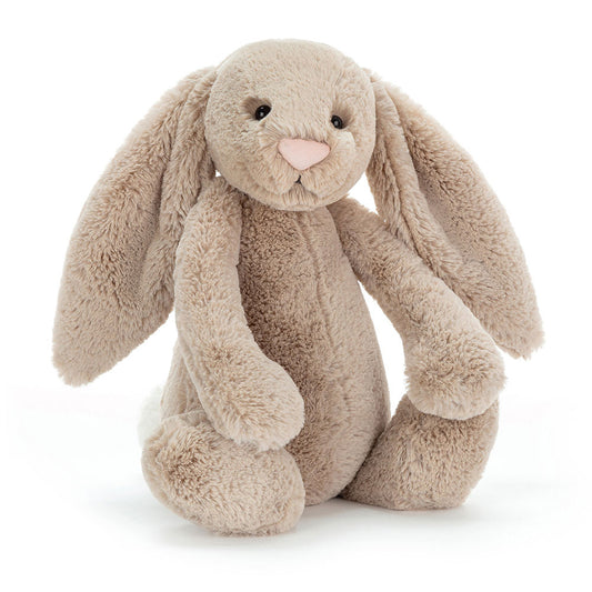 A large, beige stuffed bunny with floppy ears