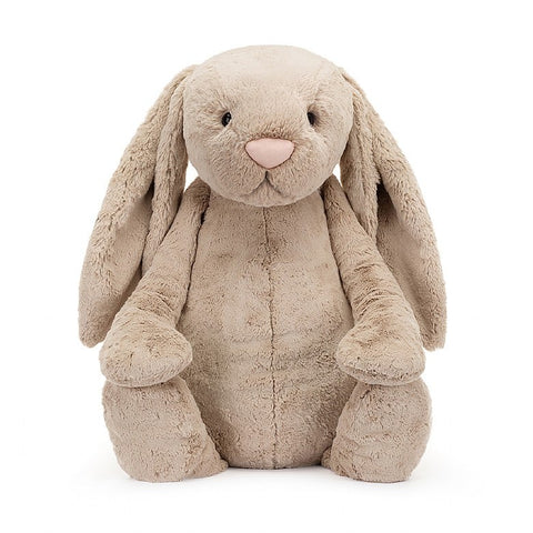 A very large beige-colored stuffed bunny with floppy ears
