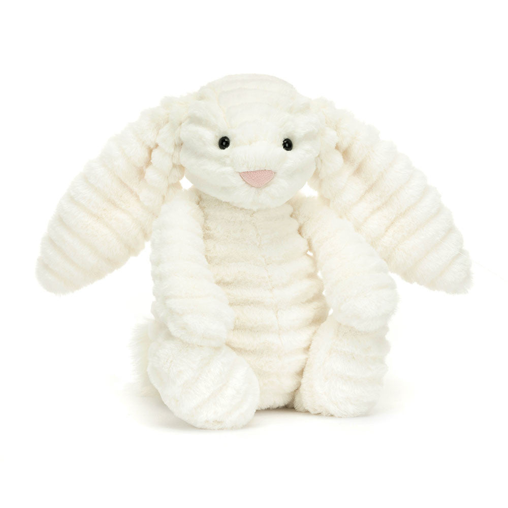 A stuffed bunny with white ribbed fur, floppy ears, and a pink nose