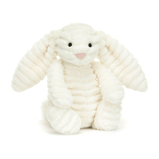 A stuffed bunny with white ribbed fur, floppy ears, and a pink nose