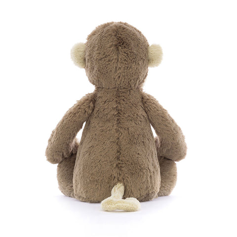 Image shows a back view of the stuffed monkey
