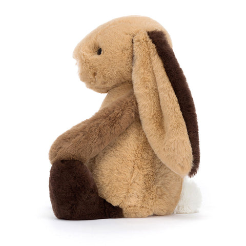 Image shows a side view of the brown patchwork bunny. Its arms are a toffee brown color.