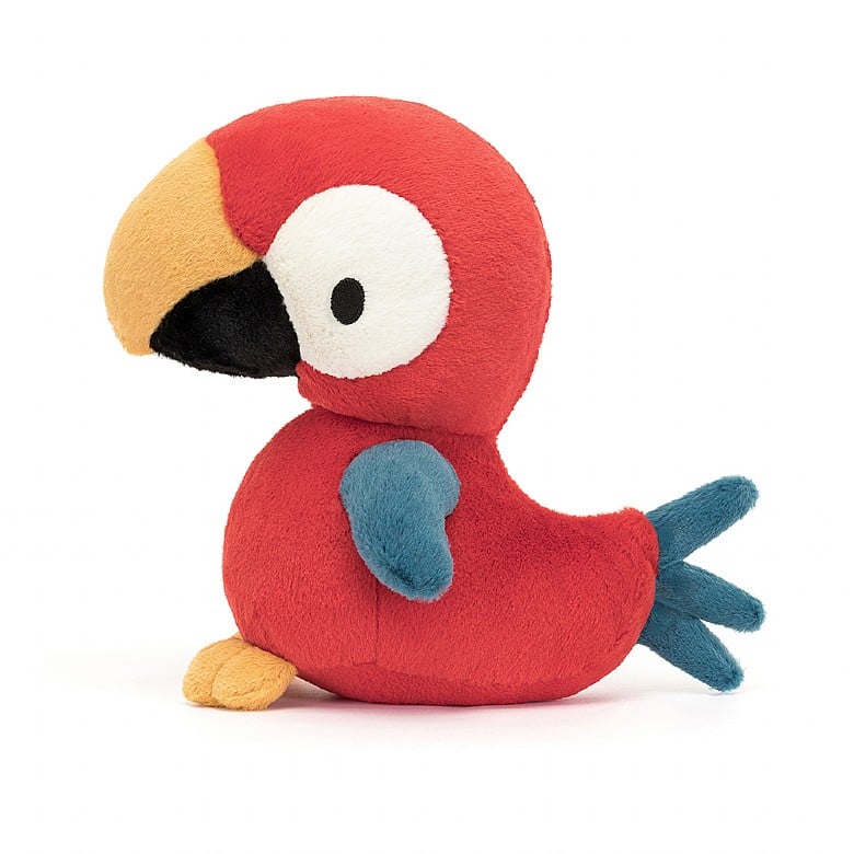 A side view of the same stuffed red parrot