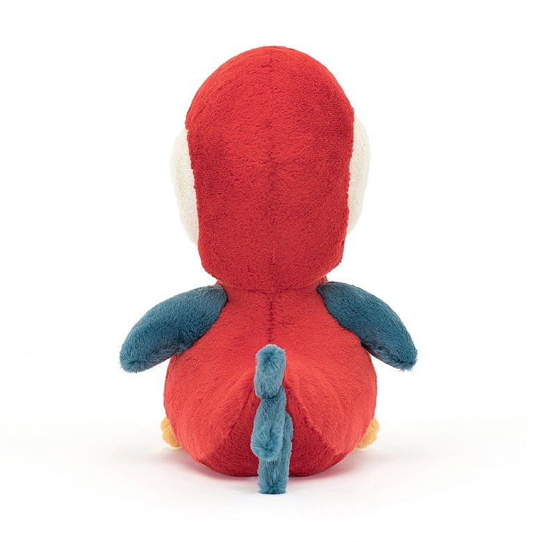 A back view of the same stuffed red parrot