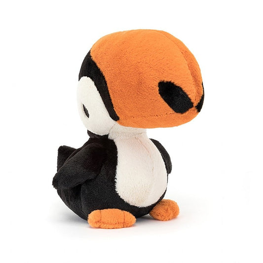 A stuffed Toucan with a large orange beak