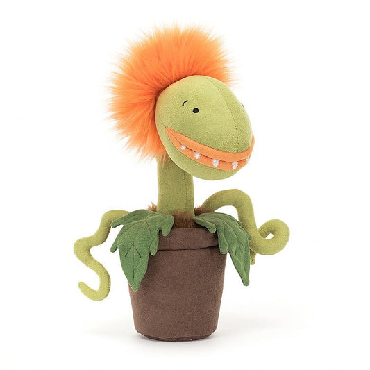 A stuffed potted plant with orange fluffy hair, orange lips, and small fangs