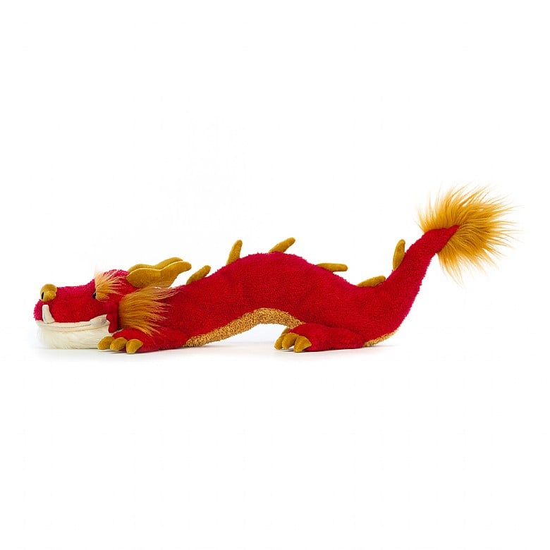 A side view of the stuffed dragon