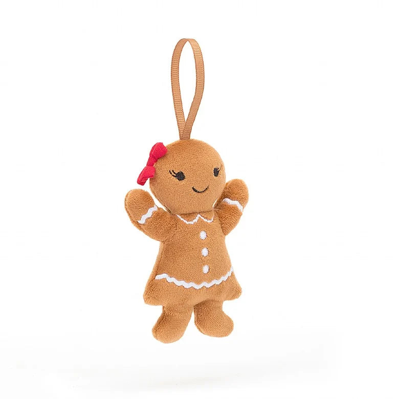 A Christmas ornament in the form of a stuffed gingerbread lady