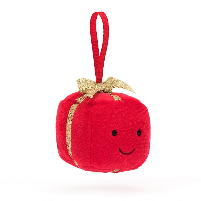 A Christmas ornament in the form of a red wrapped gift with a sparkly gold bow