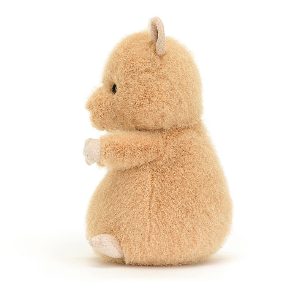 A side view of the stuffed hamster