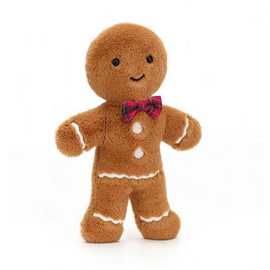 A stuffed gingerbread man with white accents and a red plaid bow tie