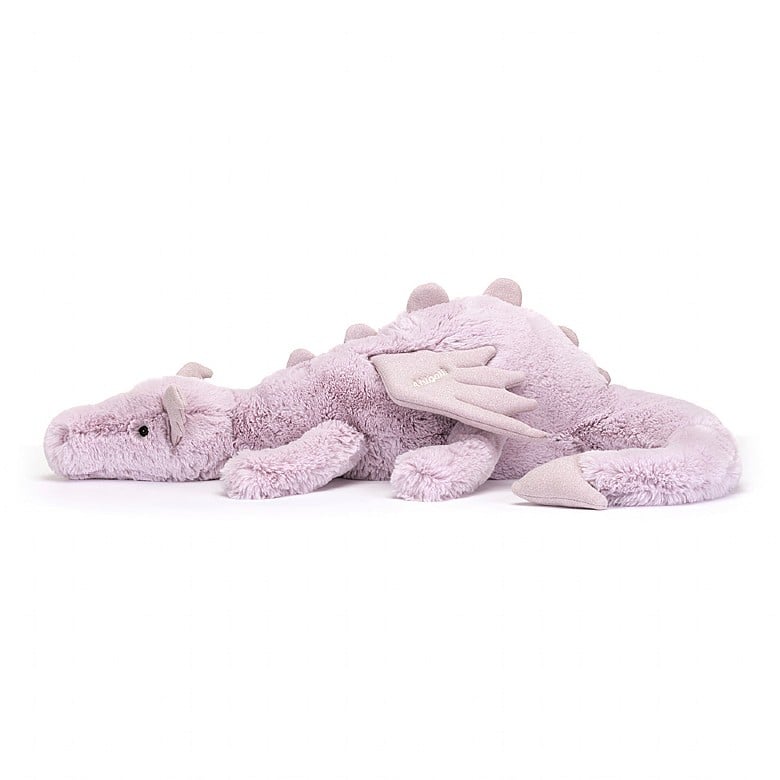 A side view of the stuffed lavender dragon