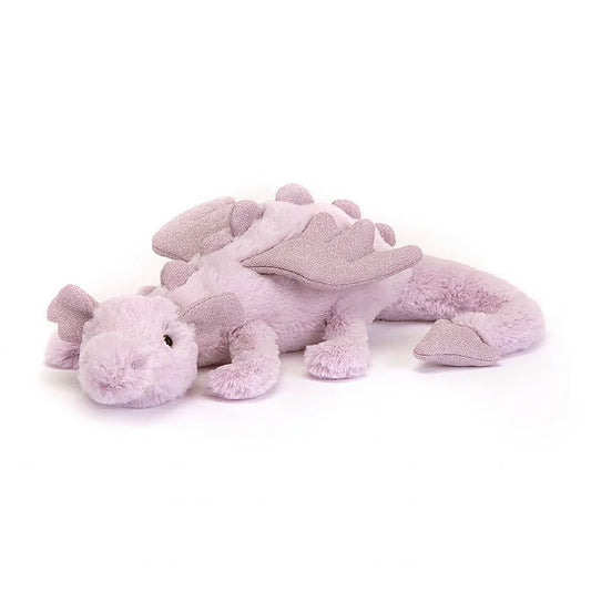 A small, stuffed lavender-colored dragon. The dragon is laying down.