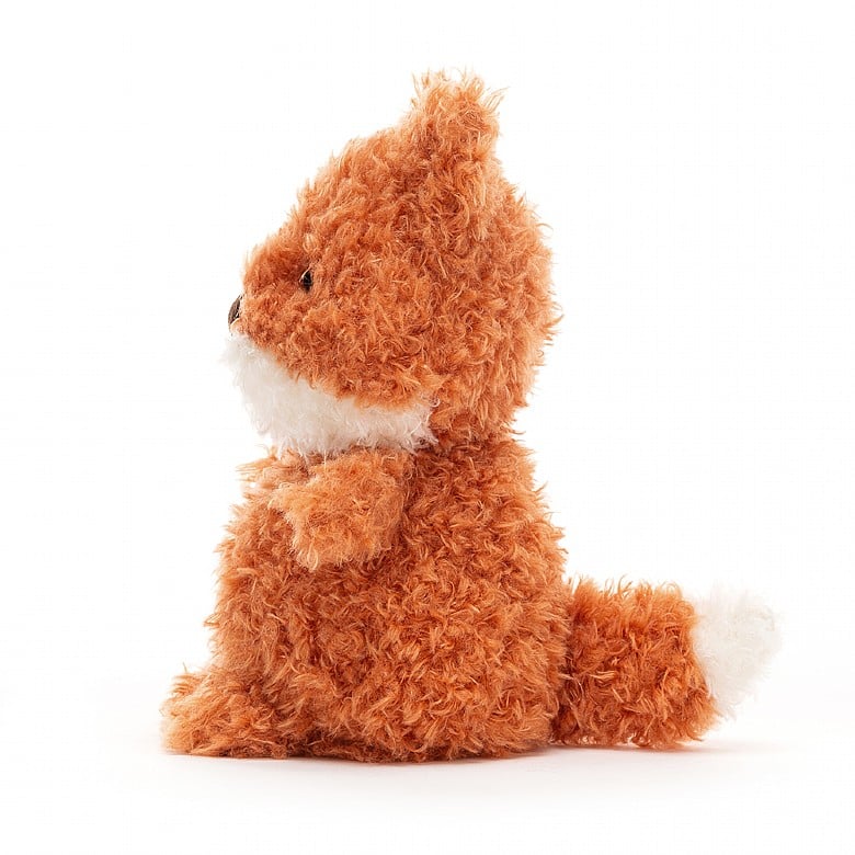 A side view of the scruffy stuffed fox