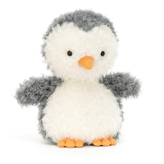 A scruffy looking stuffed penguin