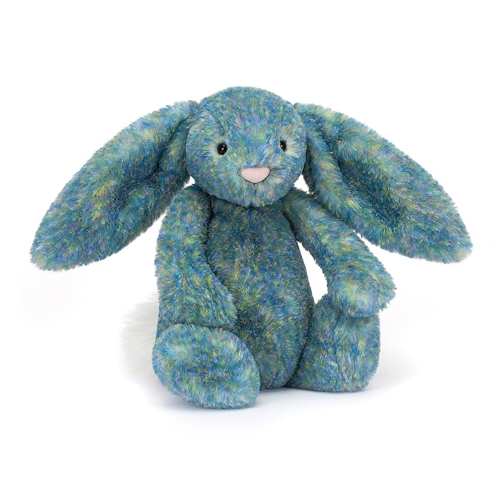 A stuffed bunny with mottled blue and green fur, floppy ears, and a pink nose