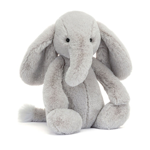 Image shows a soft-looking grey stuffed elephant